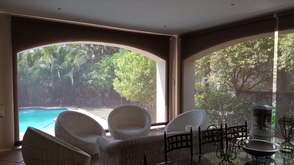 Sheerweave solar shade blinds lowered for sun and heat control